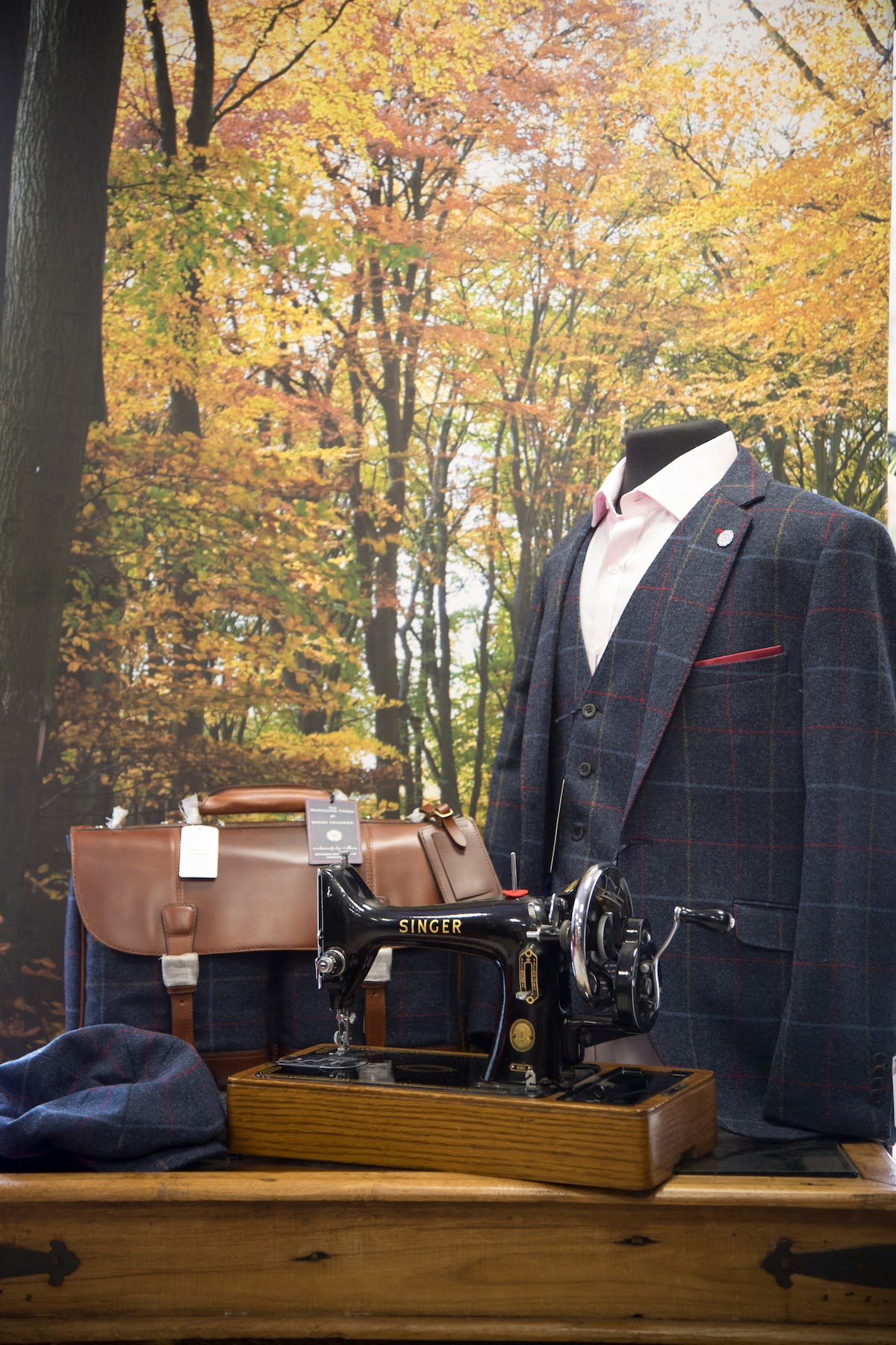 Knights Tailoring - Suit with leather bag and old sewing machine
